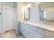 Well-lit bathroom with double vanity, modern fixtures, and ample counter space at 595 E Cabarrus St, Raleigh, NC 27601