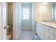 Bright and airy bathroom featuring modern vanity and neutral color scheme at 595 E Cabarrus St, Raleigh, NC 27601