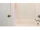 A tiled shower and bathtub feature a curtain and modern faucet at 595 E Cabarrus St, Raleigh, NC 27601