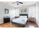 Serene bedroom with hardwood floors, natural light, and tasteful decor for a relaxing retreat at 595 E Cabarrus St, Raleigh, NC 27601