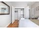 Bedroom featuring hardwood floors and open closet space at 595 E Cabarrus St, Raleigh, NC 27601