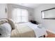 Cozy bedroom with natural light, work station, and stylish mirror at 595 E Cabarrus St, Raleigh, NC 27601