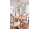 Elegant dining room featuring a wooden table, upholstered chairs, and a stylish light fixture at 595 E Cabarrus St, Raleigh, NC 27601
