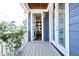 Inviting covered front porch with a view into the home's interior at 595 E Cabarrus St, Raleigh, NC 27601