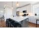 Modern kitchen boasts a spacious island, stainless steel appliances, and elegant pendant lighting at 595 E Cabarrus St, Raleigh, NC 27601