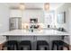 Stylish kitchen with a large island, counter seating, modern appliances, and decorative pendant lights at 595 E Cabarrus St, Raleigh, NC 27601