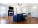 Cozy living room with hardwood floors, a fireplace, comfortable seating, and natural light at 595 E Cabarrus St, Raleigh, NC 27601