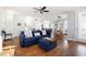 Inviting living room featuring hardwood floors, neutral walls, and seamless flow to dining and kitchen at 595 E Cabarrus St, Raleigh, NC 27601