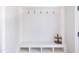 Bright mudroom features hooks, shelving, and shoe storage for organization and convenience at 595 E Cabarrus St, Raleigh, NC 27601