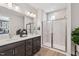 Bathroom features a double sink vanity and frameless glass shower at 611 Callan View Ave, Wake Forest, NC 27587