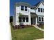 Attractive two-story home with modern design, complemented by a well-manicured lawn and landscaping at 611 Callan View Ave, Wake Forest, NC 27587