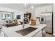 Open kitchen featuring a breakfast bar overlooking the dining and living area for seamless entertaining at 611 Callan View Ave, Wake Forest, NC 27587