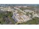 An aerial view of a neighborhood surrounded by a forest, featuring a pond and lots of trees at 629 Newlyn Dr, Raleigh, NC 27606