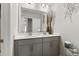 Bright bathroom with a double vanity, modern fixtures, and a decorative flower arrangement at 629 Newlyn Dr, Raleigh, NC 27606