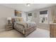 Cozy bedroom with natural light from two windows, a queen bed, and carpeted floors at 629 Newlyn Dr, Raleigh, NC 27606
