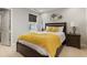 Well-lit bedroom with a queen bed, natural light, neutral walls, and hardwood floors at 629 Newlyn Dr, Raleigh, NC 27606