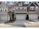 Charming townhouse with attached garage, neutral colors, and well-maintained front yard at 629 Newlyn Dr, Raleigh, NC 27606