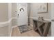 Bright foyer with a white front door, modern table, and light wood flooring at 629 Newlyn Dr, Raleigh, NC 27606
