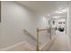 Upstairs hallway with carpet floor and a view of the living room at the end at 629 Newlyn Dr, Raleigh, NC 27606