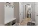 Hallway with coat rack and a view of the adjacent half bathroom at 629 Newlyn Dr, Raleigh, NC 27606