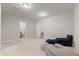 Spacious carpeted living room with seating, neutral walls, and good lighting at 629 Newlyn Dr, Raleigh, NC 27606