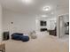 Open living room with comfortable seating, a TV, carpeted floors, and neutral walls at 629 Newlyn Dr, Raleigh, NC 27606