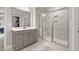 Modern main bathroom with glass enclosed shower, dual sink vanity, and marble tile floor at 629 Newlyn Dr, Raleigh, NC 27606