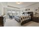 Large primary bedroom featuring three bright windows and a spacious layout at 629 Newlyn Dr, Raleigh, NC 27606
