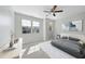 Serene bedroom features neutral tones, plush bedding, and ample natural light, offering a tranquil retreat at 684 Wickham Ridge Rd, Apex, NC 27539