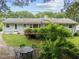 The beautiful backyard of the house featuring a patio and well-maintained lawn at 808 Ravenwood Dr, Raleigh, NC 27606