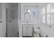 Well-lit bathroom featuring a vanity, a white toilet, and a tiled shower at 808 Ravenwood Dr, Raleigh, NC 27606