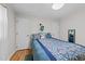 Inviting bedroom with natural light, wood floors, closet space, and a patterned bedspread at 808 Ravenwood Dr, Raleigh, NC 27606