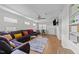 Comfortable living space featuring a large sectional and lots of natural light at 808 Ravenwood Dr, Raleigh, NC 27606
