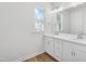 Bathroom featuring a double vanity with white cabinets and modern fixtures at 809 Hyperion Aly, Wake Forest, NC 27587