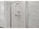 Elegant bathroom with a glass-enclosed shower and marble-patterned tile at 809 Hyperion Aly, Wake Forest, NC 27587