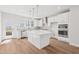 Bright kitchen featuring a large island, stainless steel appliances, and white cabinetry at 809 Hyperion Aly, Wake Forest, NC 27587