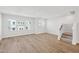 Spacious living room with hardwood floors and plenty of natural light from large windows at 809 Hyperion Aly, Wake Forest, NC 27587