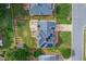 Aerial view of a home showing solar panels, a large backyard, a patio, and a deck area at 8913 Walking Stick Trl, Raleigh, NC 27615