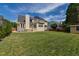 Spacious backyard features a large lawn, patio, and seating area at 8913 Walking Stick Trl, Raleigh, NC 27615