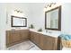 Bright bathroom featuring double vanities and a soaking tub at 8913 Walking Stick Trl, Raleigh, NC 27615