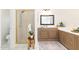 Bathroom vanity features a framed mirror, white countertops, and white flower accent at 8913 Walking Stick Trl, Raleigh, NC 27615