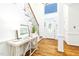 Bright foyer with hardwood floors, staircase, and stylish console table at 8913 Walking Stick Trl, Raleigh, NC 27615
