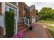 Landscaped front entrance with brick walkway and steps, leading to the front door and an attached garage at 8913 Walking Stick Trl, Raleigh, NC 27615