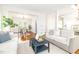 Open-concept living and dining areas with hardwood floors, lots of sunlight and stylish decor at 8913 Walking Stick Trl, Raleigh, NC 27615