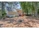 Spacious backyard features a deck, fire pit, and lush greenery at 9308 Carisbrook Ct, Raleigh, NC 27615