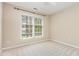 Neutral bedroom with carpet, large windows, and lots of natural light at 9308 Carisbrook Ct, Raleigh, NC 27615