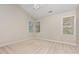 Neutral bedroom with carpet, a ceiling fan, large windows, and lots of natural light at 9308 Carisbrook Ct, Raleigh, NC 27615