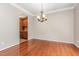 Dining room with hardwood floors and decorative chandelier at 9308 Carisbrook Ct, Raleigh, NC 27615