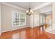 Dining area featuring hardwood floors and abundant natural light at 9308 Carisbrook Ct, Raleigh, NC 27615