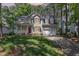 Charming two-story home with a well-manicured lawn, a red front door, and an attached garage at 9308 Carisbrook Ct, Raleigh, NC 27615